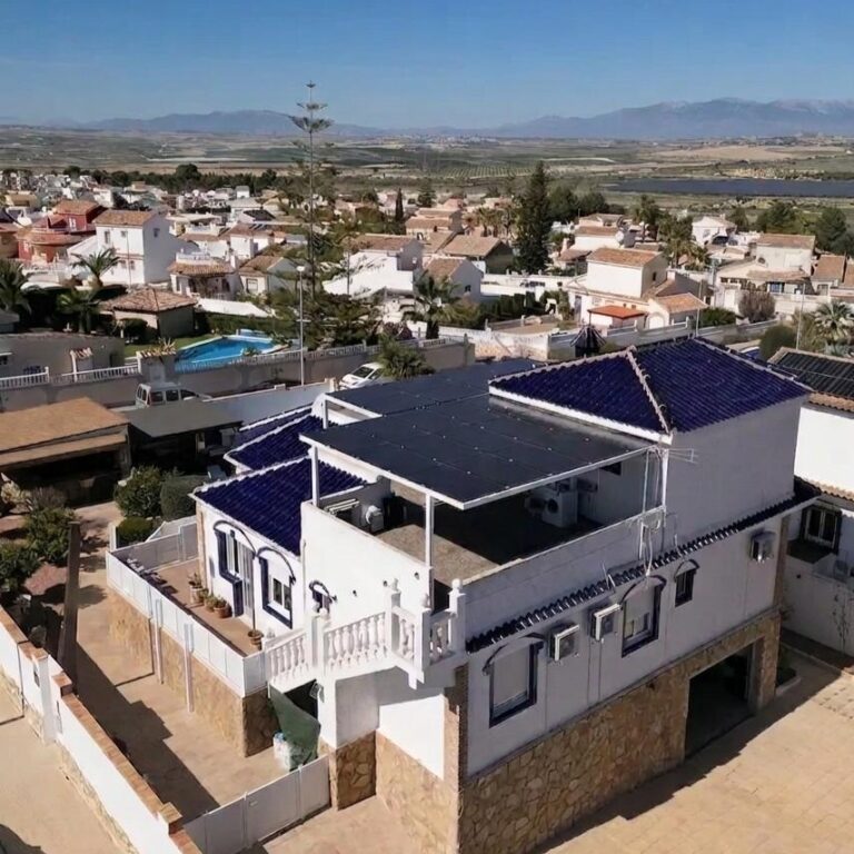 Solar Pergola by Go Solar in Spain. White villa, white Pergola. This is 3 panels wide by 5 long.
